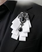 Ornate Black Gem & White Ribbon Bow Tie Brooch