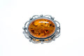 Broche ovale classique en ambre encadré