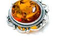 Broche ovale classique en ambre encadré