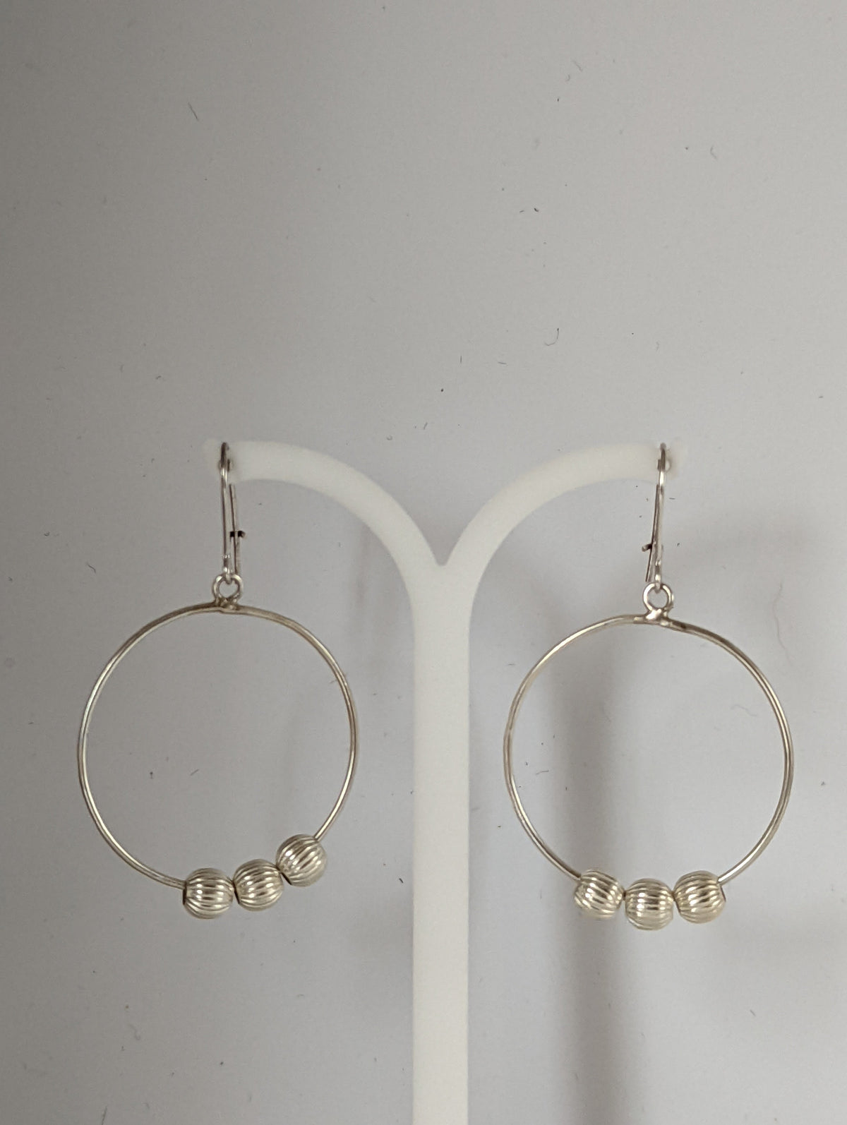 Silver Steed Loop with Buds Dangling Earrings