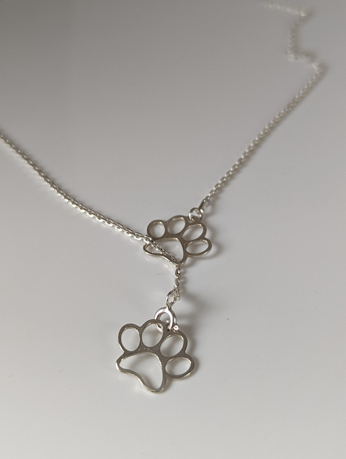 Silver Steed Thread Through Double Paw Print Silver Necklace