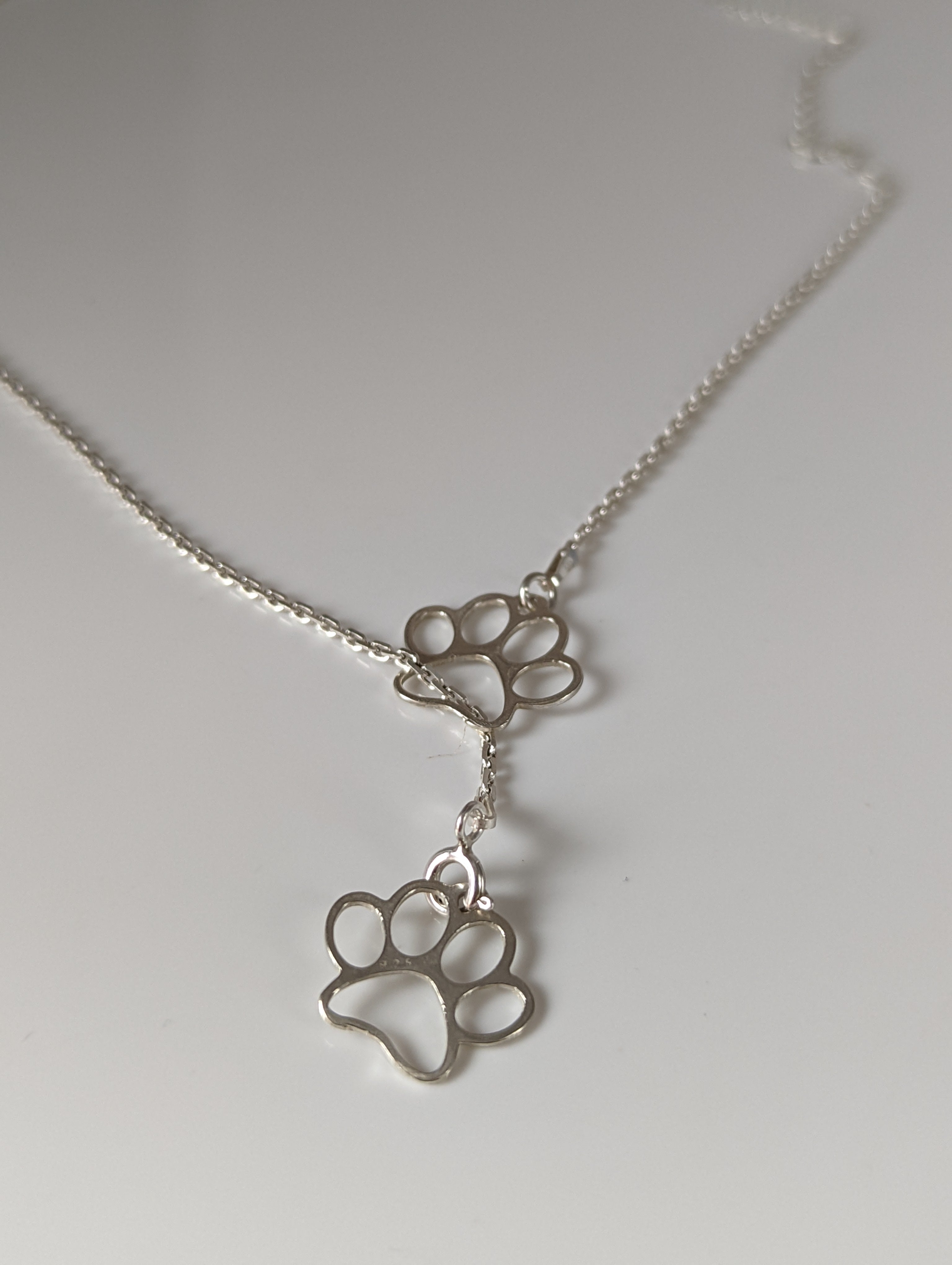 Silver Steed Thread Through Double Paw Print Silver Necklace