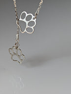 Silver Steed Thread Through Double Paw Print Silver Necklace