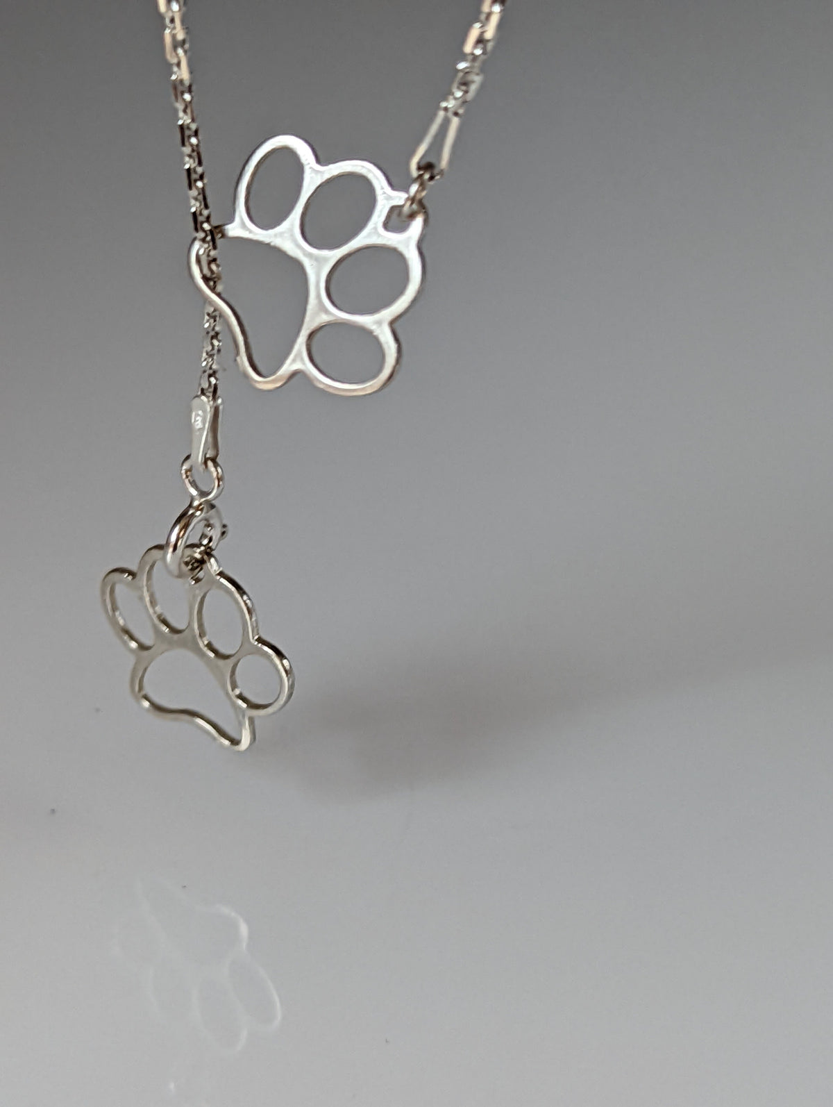 Silver Steed Thread Through Double Paw Print Silver Necklace