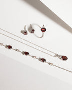 Garnet Oval Stud Earrings in Sterling Silver