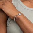 Bracelet extensible Beginning avec breloques disques