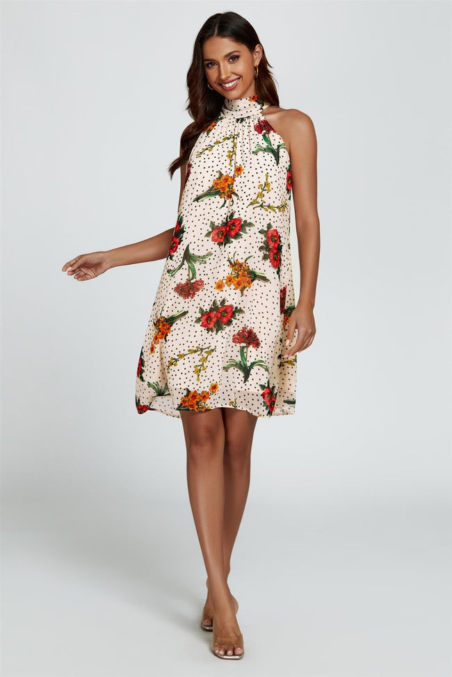 Mini-robe dos nu fleurie de couleur blanc cassé avec liens à nouer