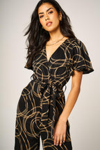 Abstract Line Print Wrap Top Jumpsuit In Black