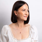 Elements Gold Oval Cut Pink Topaz Drop Earrings