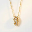 Gold Lyra Necklace with Barnacles and White Topaz